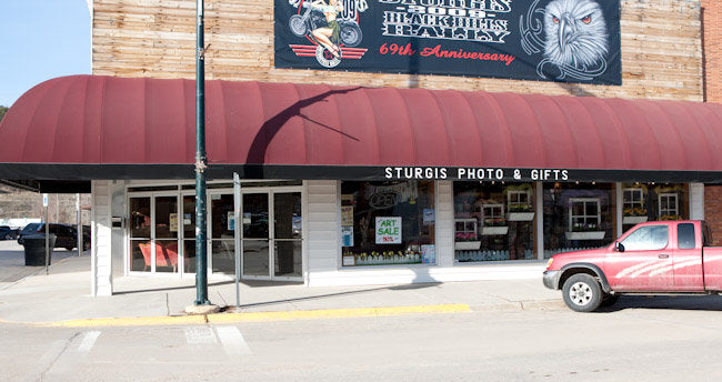 Sturgis Photo & Gifts storefront with red awning at 1081 Main Street in Sturgis, South Dakota