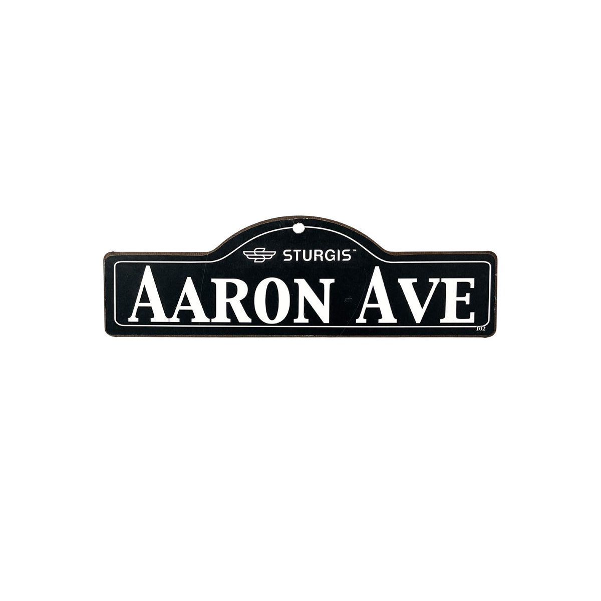 Aaron Sturgis wooden street name sign with white lettering on black