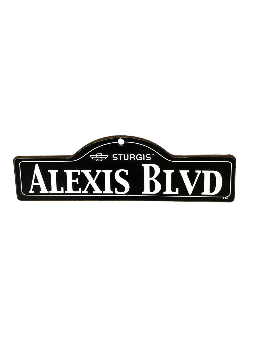 Alexis Sturgis wooden street name sign with white lettering on black