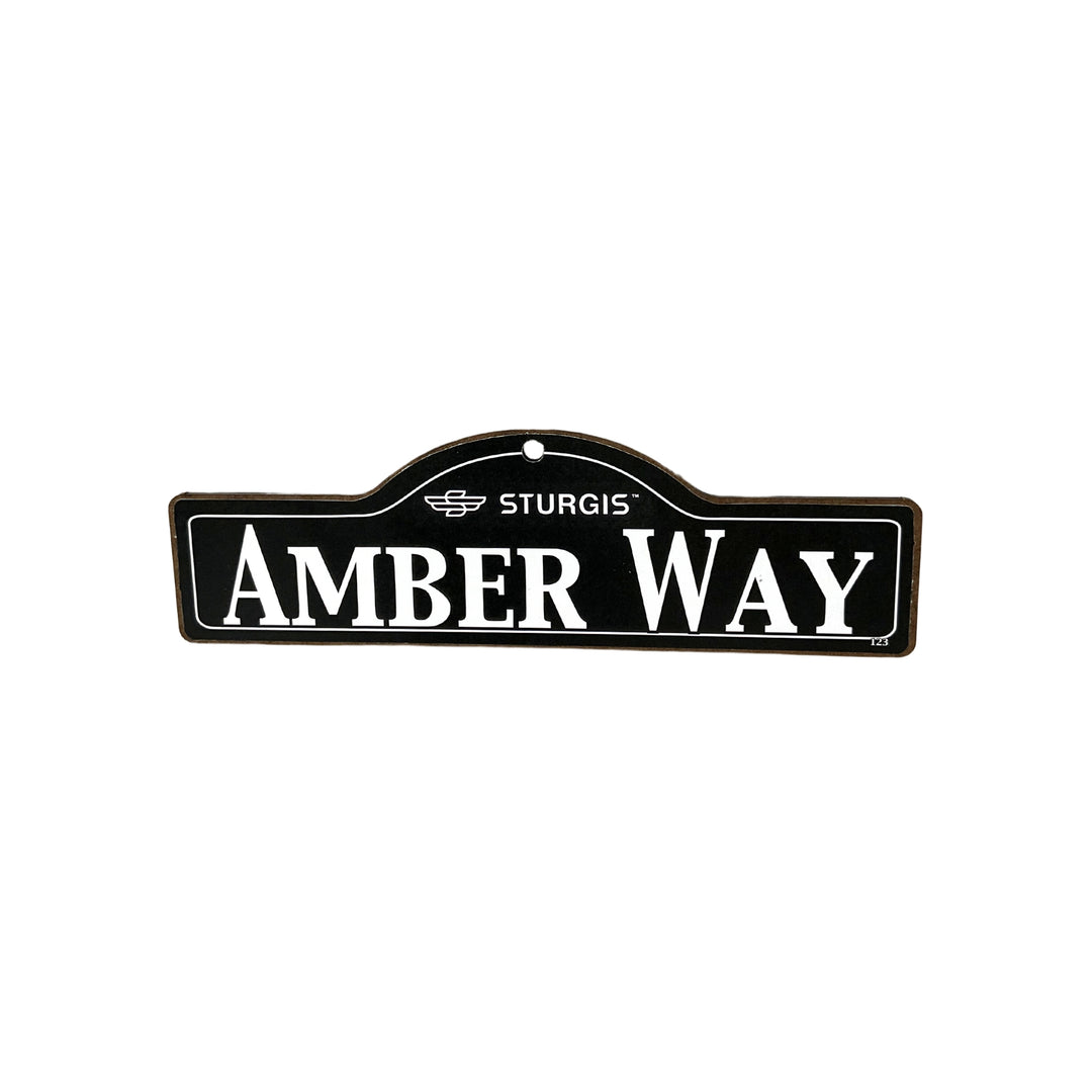 Amber Sturgis wooden street name sign with white lettering on black