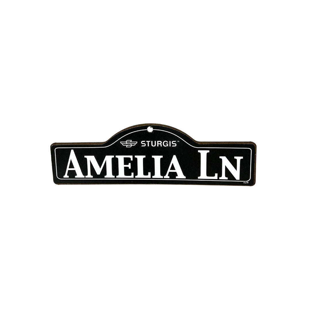 Amelia Sturgis wooden street name sign with white lettering on black