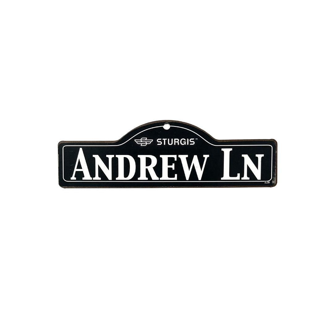 Andrew Sturgis wooden street name sign with white lettering on black