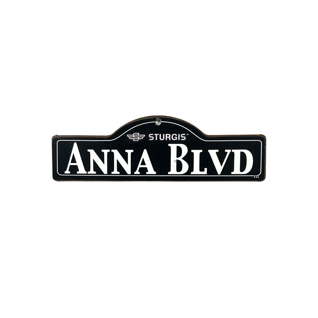 Anna Sturgis wooden street name sign with white lettering on black