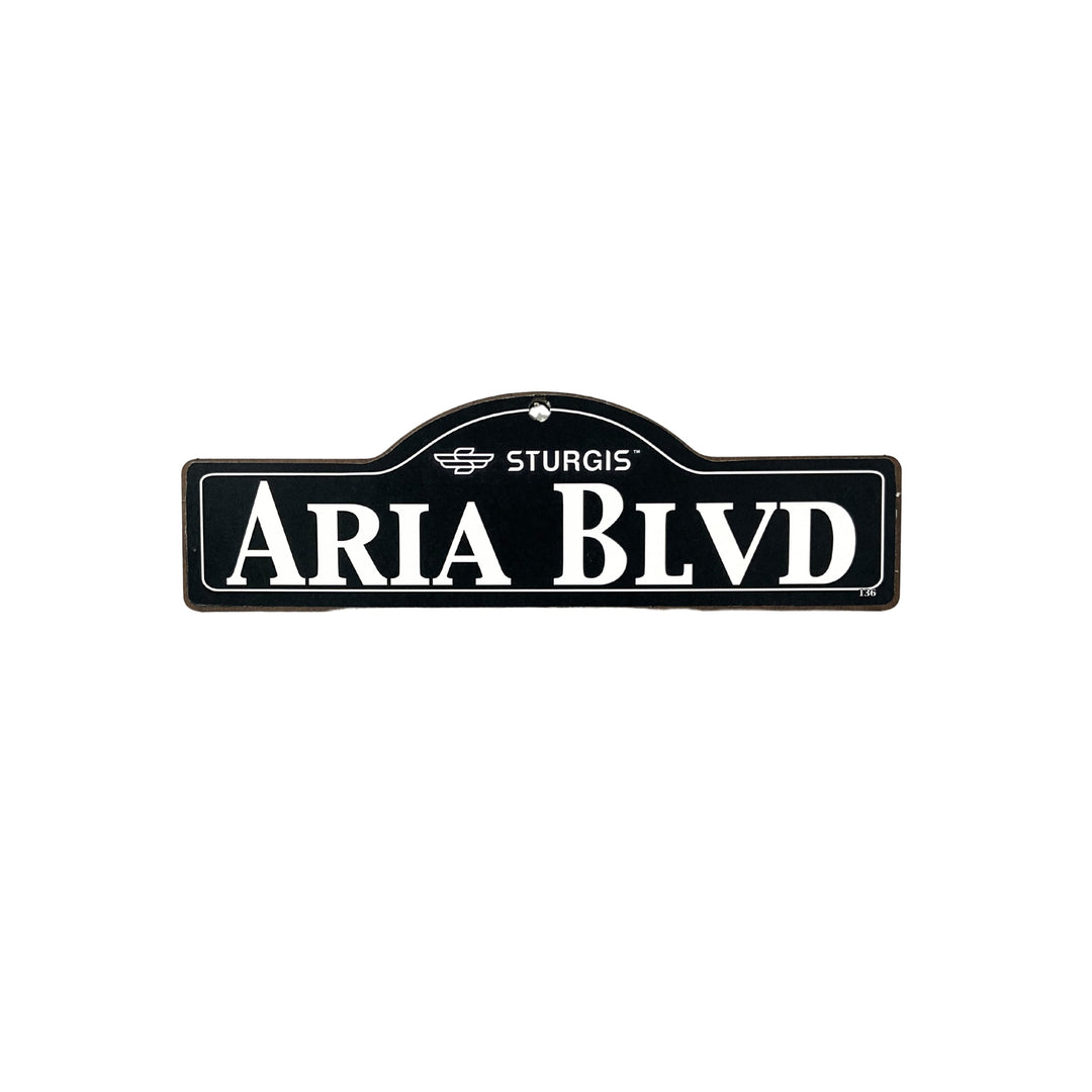 Aria Sturgis wooden street name sign with white lettering on black