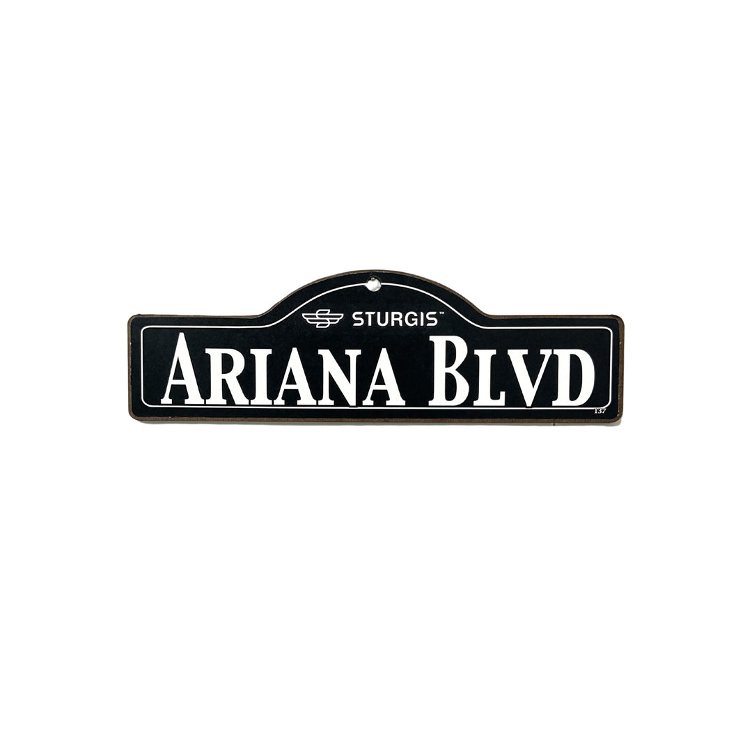 Ariana Sturgis wooden street name sign with white lettering on black