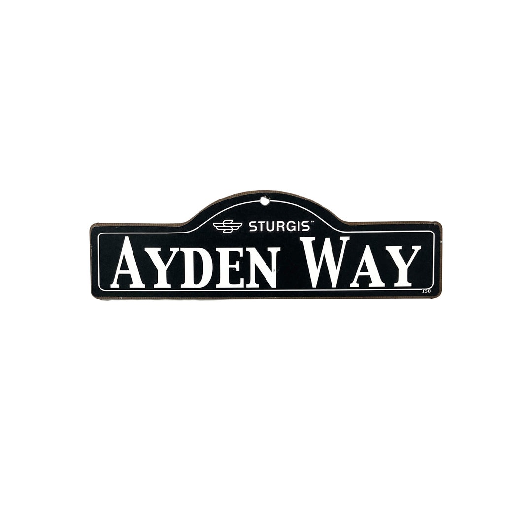 Ayden Sturgis wooden street name sign with white lettering on black