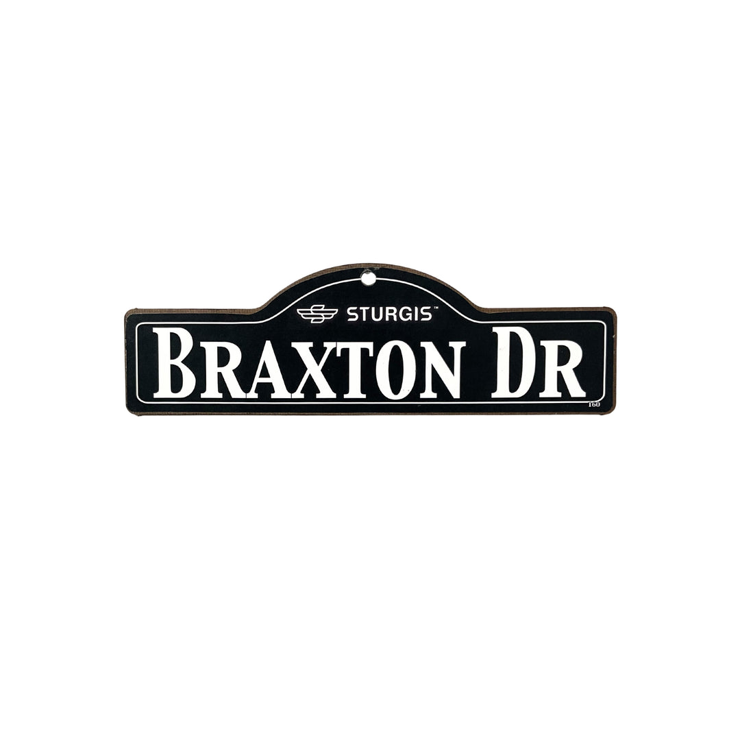 Braxton Sturgis wooden street name sign with white lettering on black
