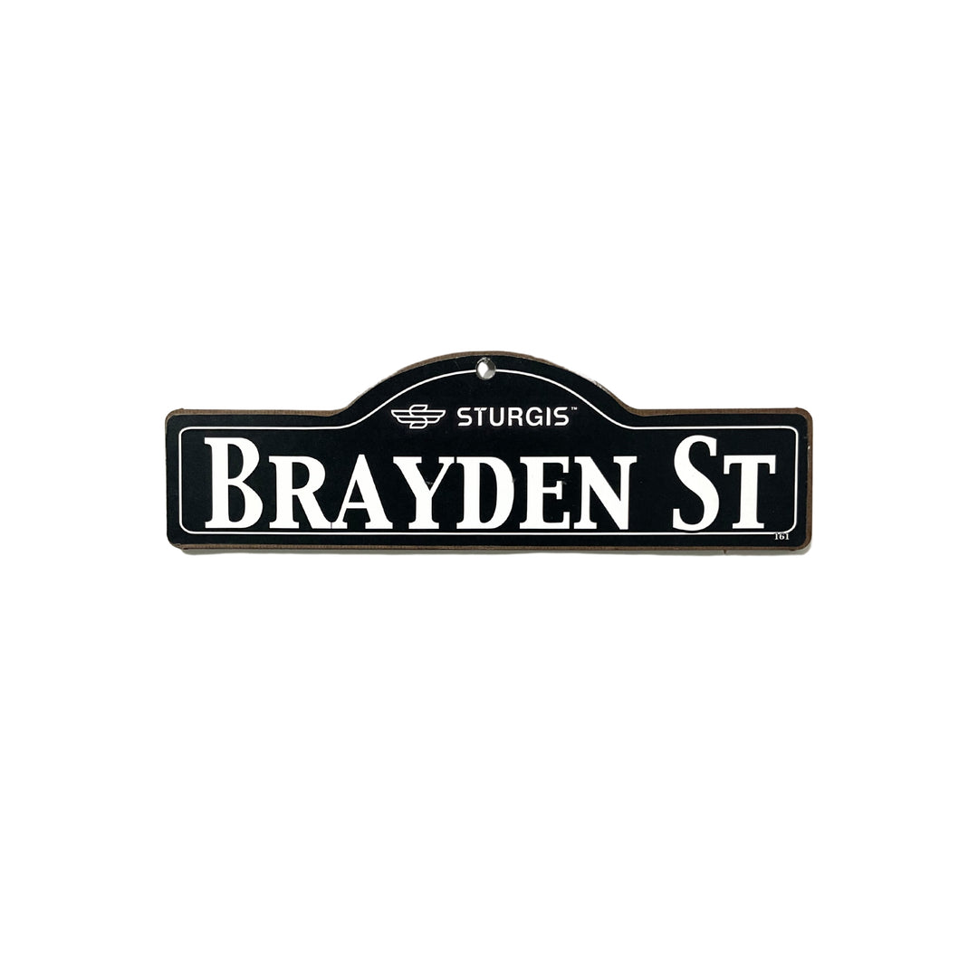 Brayden Sturgis wooden street name sign with white lettering on black