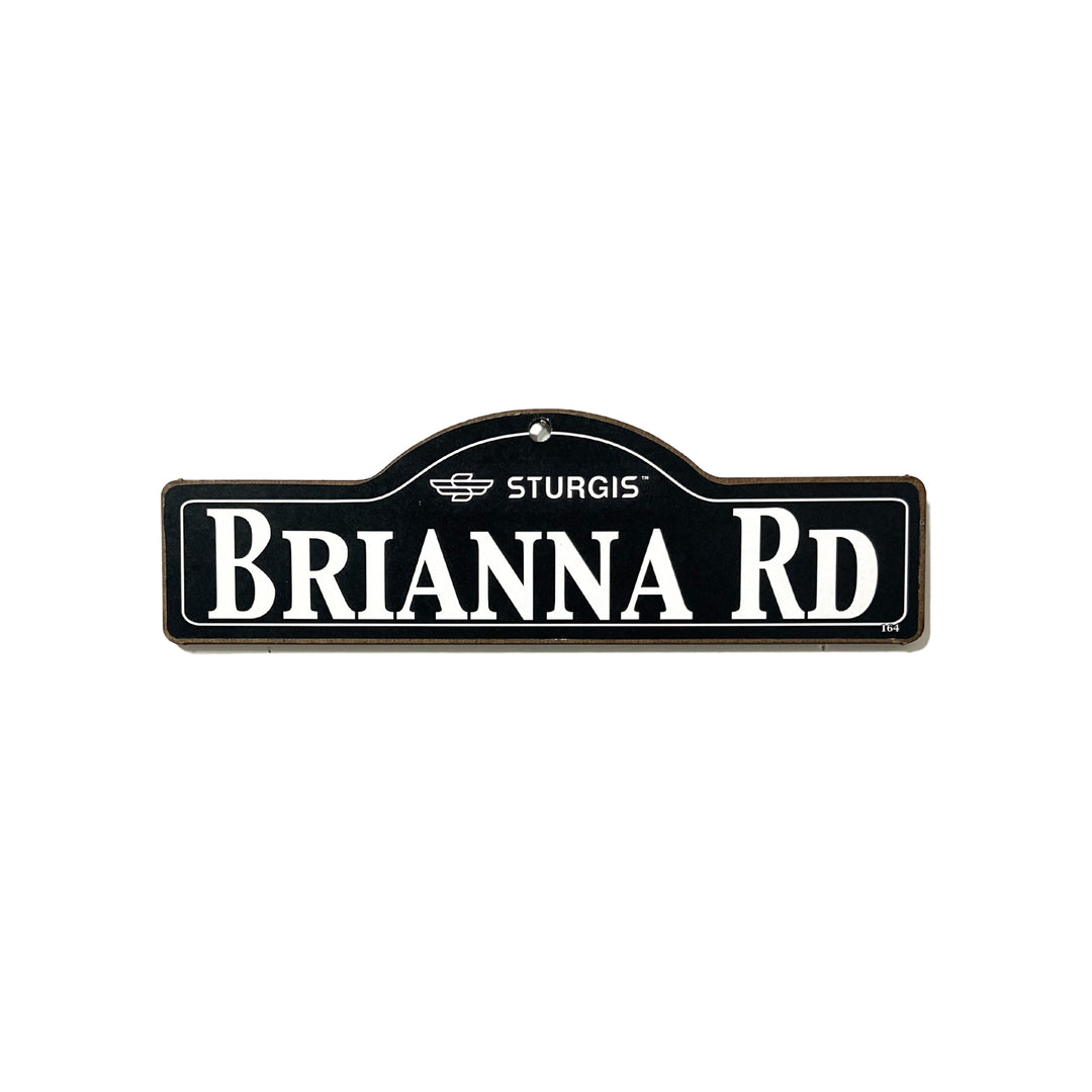 Brianna Sturgis wooden street name sign with white lettering on black
