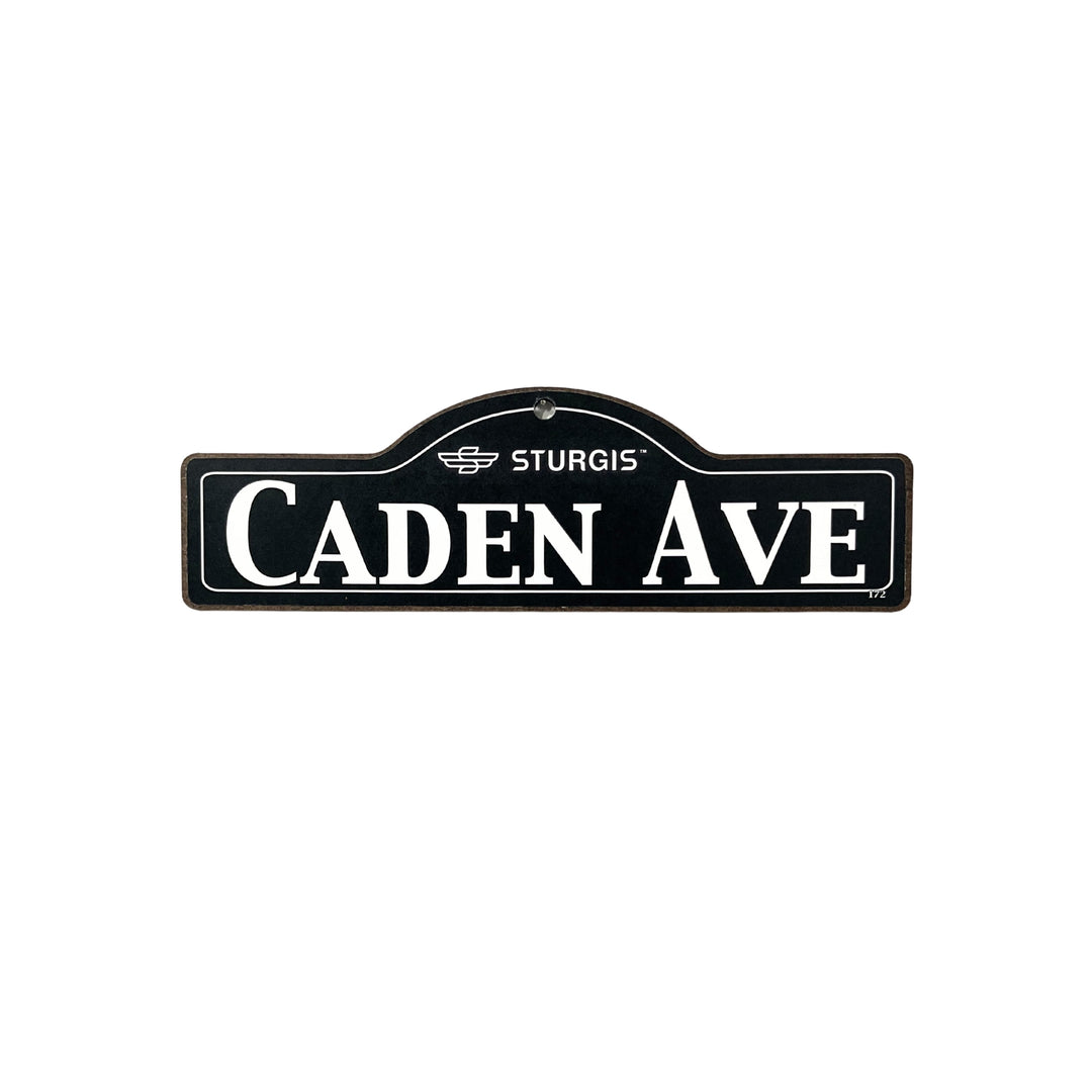 Caden Sturgis wooden street name sign with white lettering on black