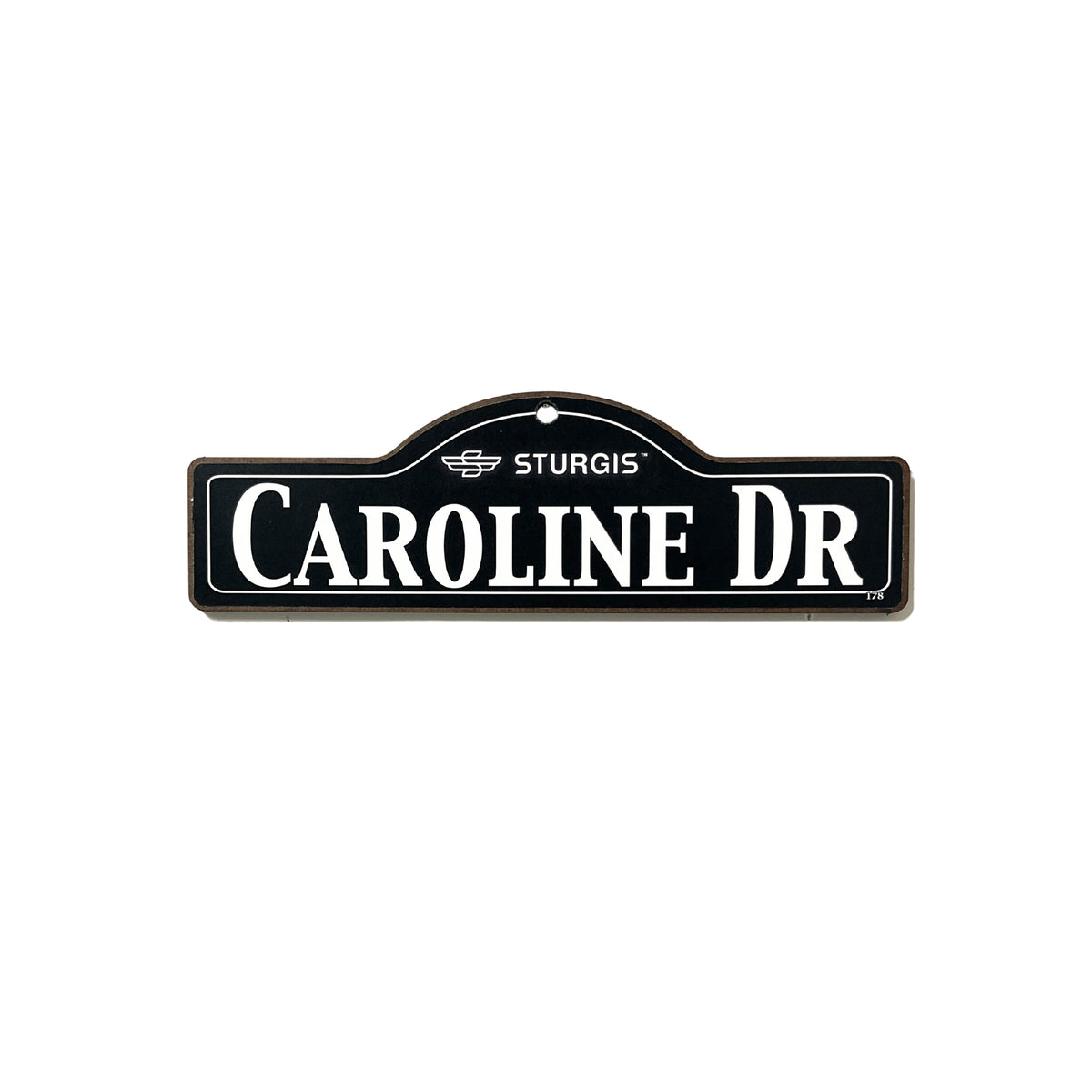 Caroline Sturgis wooden street name sign with white lettering on black