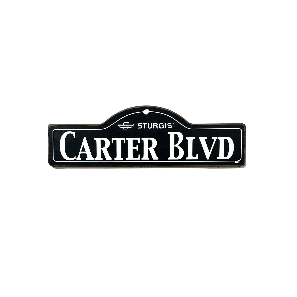 Carter Sturgis wooden street name sign with white lettering on black