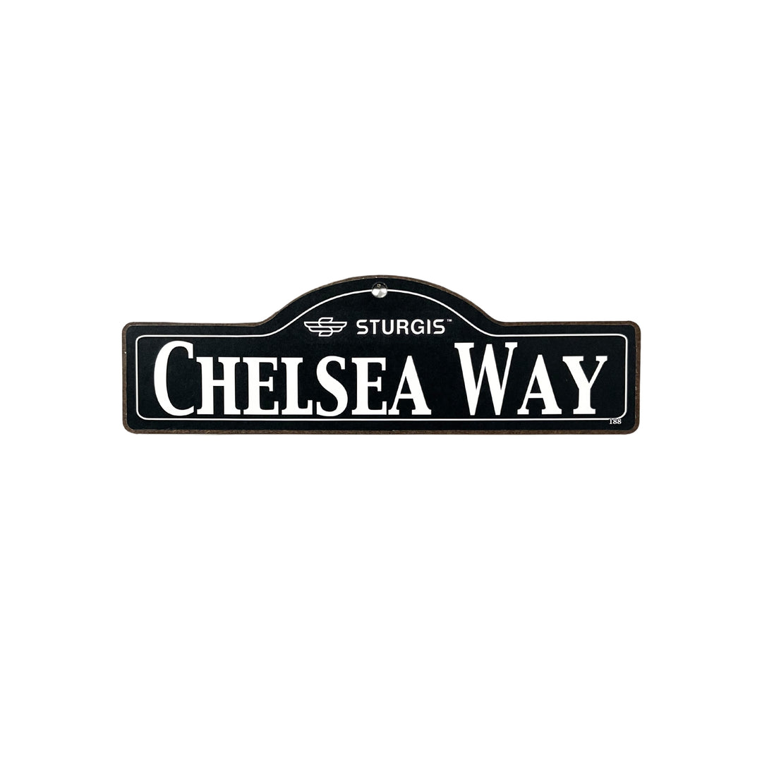 Chelsea Sturgis wooden street name sign with white lettering on black
