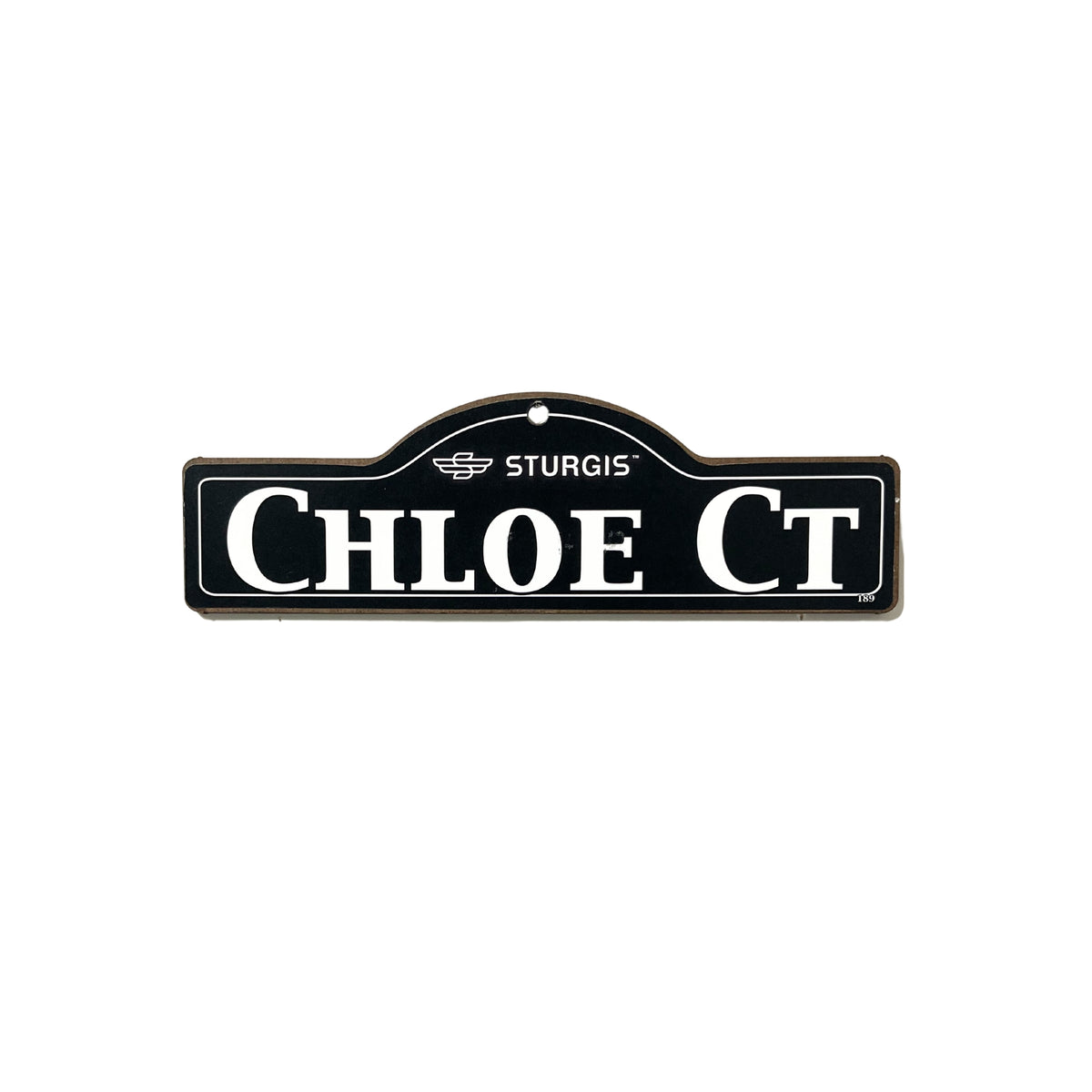 Chloe Sturgis wooden street name sign with white lettering on black