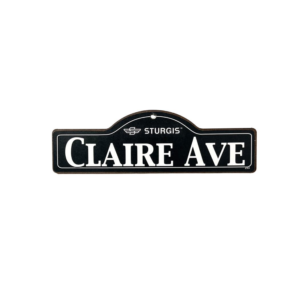 Claire Sturgis wooden street name sign with white lettering on black