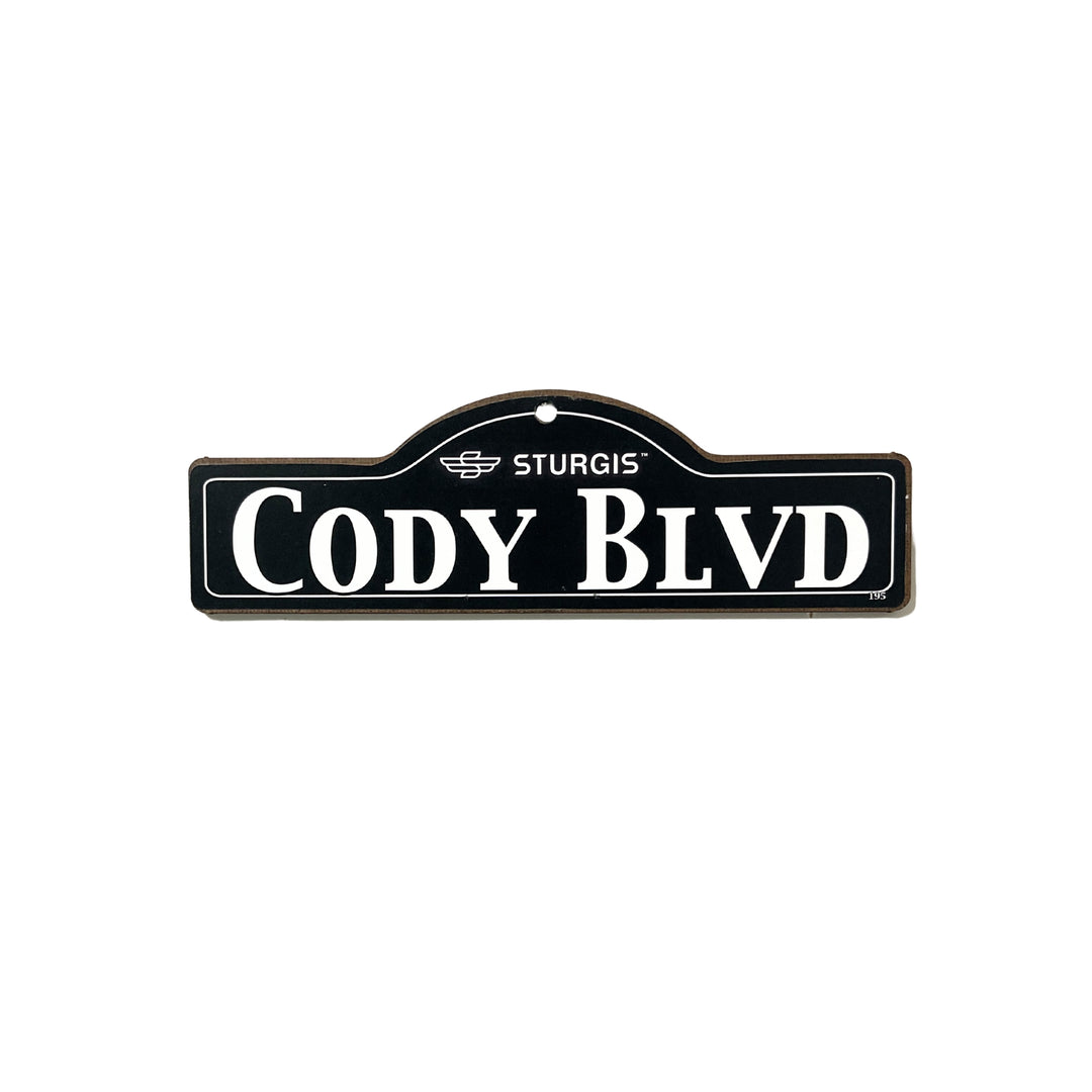 Cody Sturgis wooden street name sign with white lettering on black