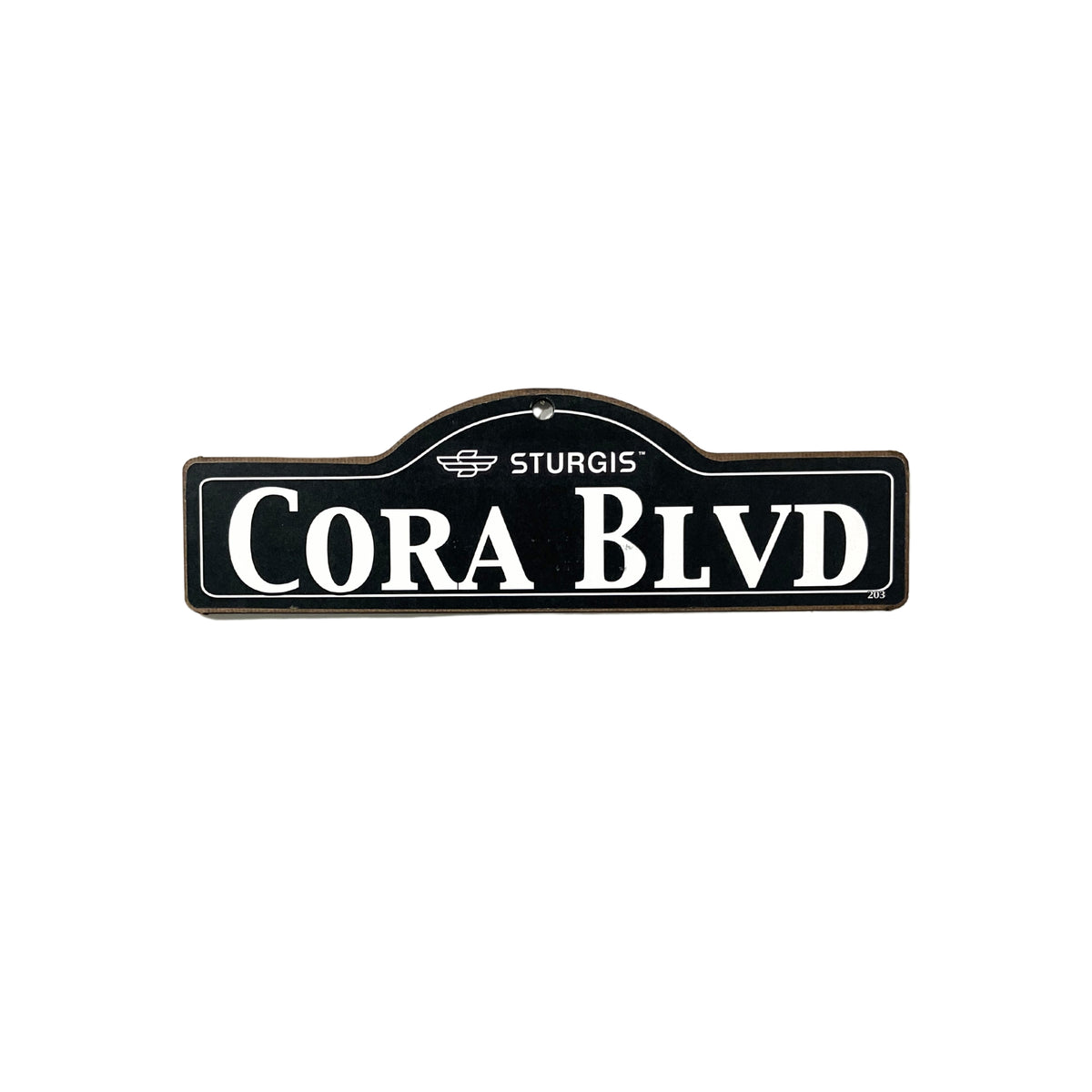 Cora Sturgis wooden street name sign with white lettering on black