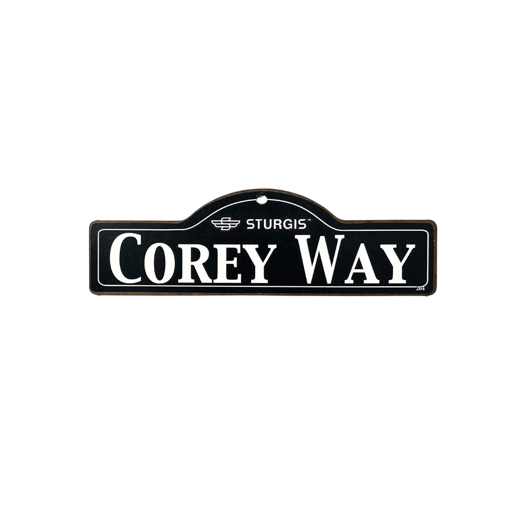 Corey Sturgis wooden street name sign with white lettering on black