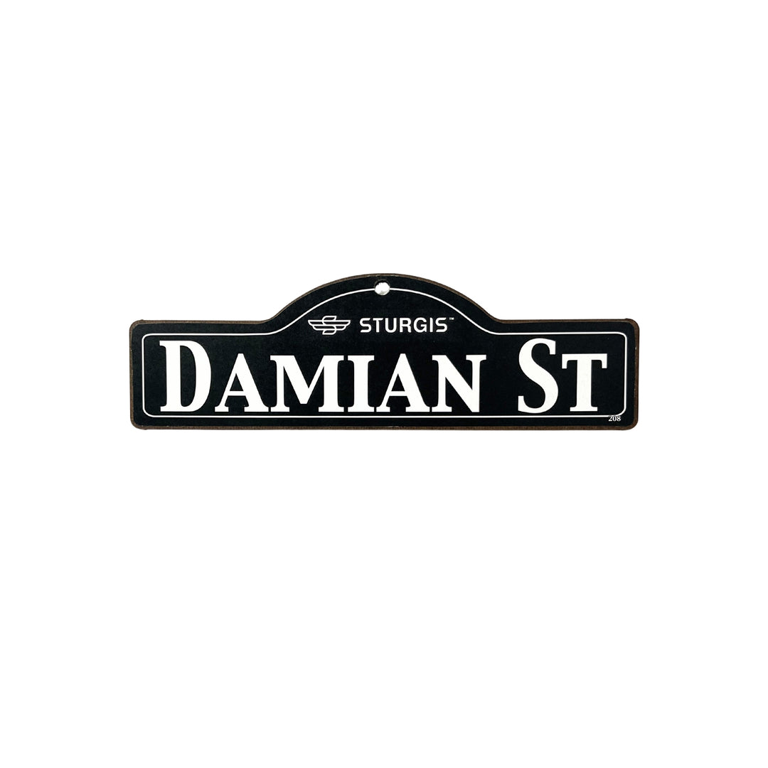 Damian Sturgis wooden street name sign with white lettering on black