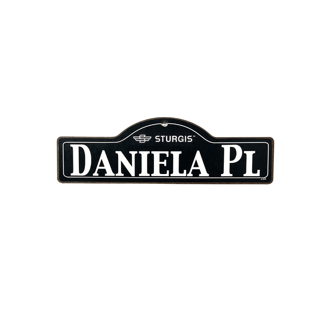 Daniela Sturgis wooden street name sign with white lettering on black