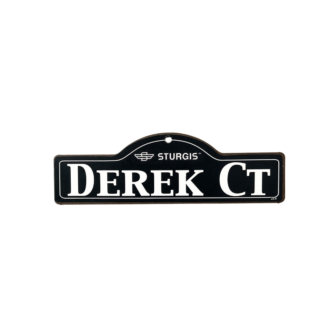 Derek Sturgis wooden street name sign with white lettering on black