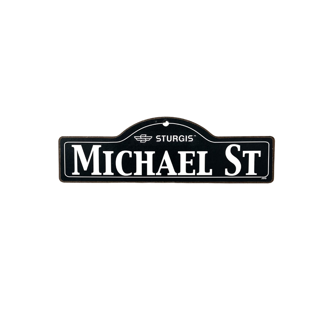 Michael Sturgis wooden street name sign with white lettering on black