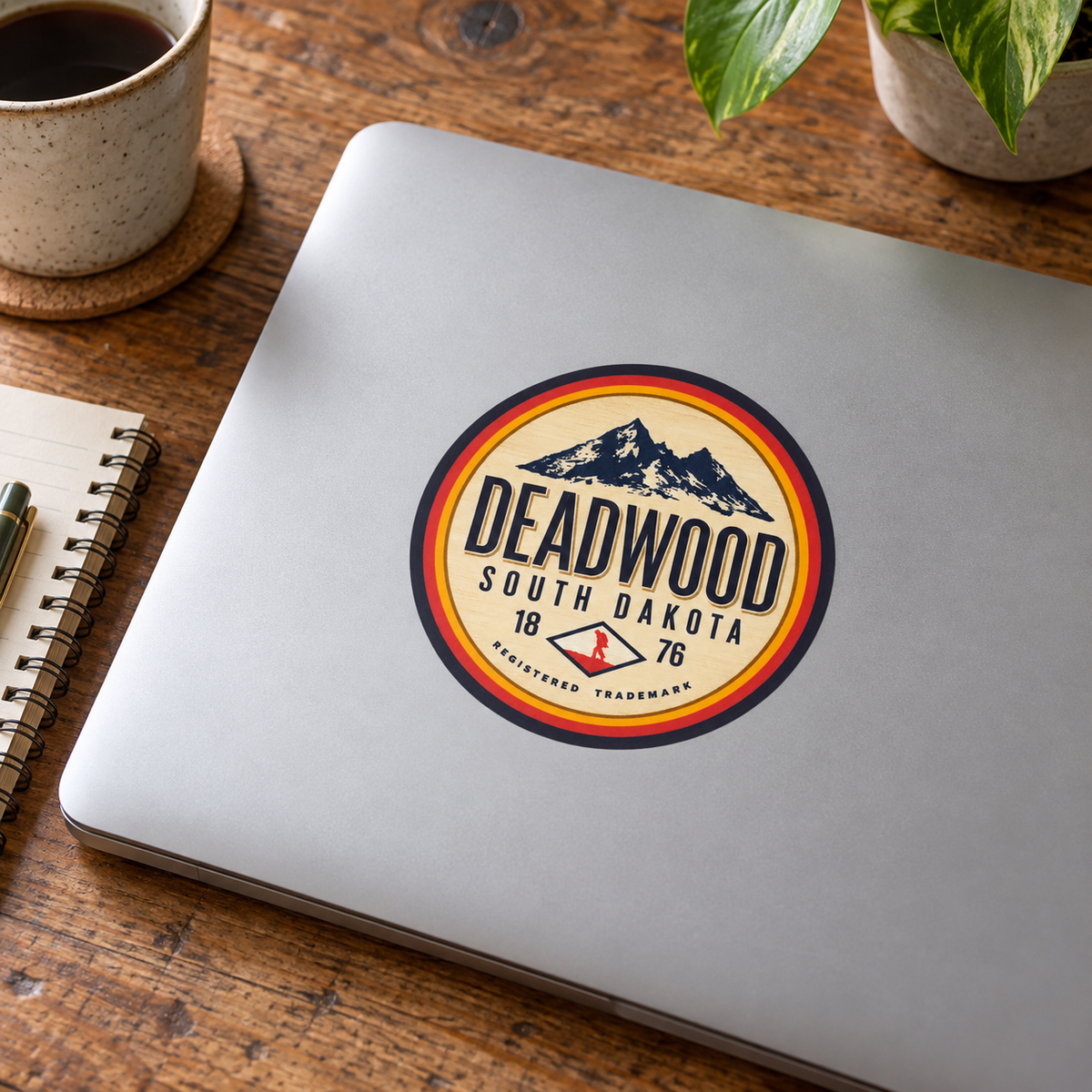 Deadwood Vintage Mountain Badge Sticker on a laptop — display mockup