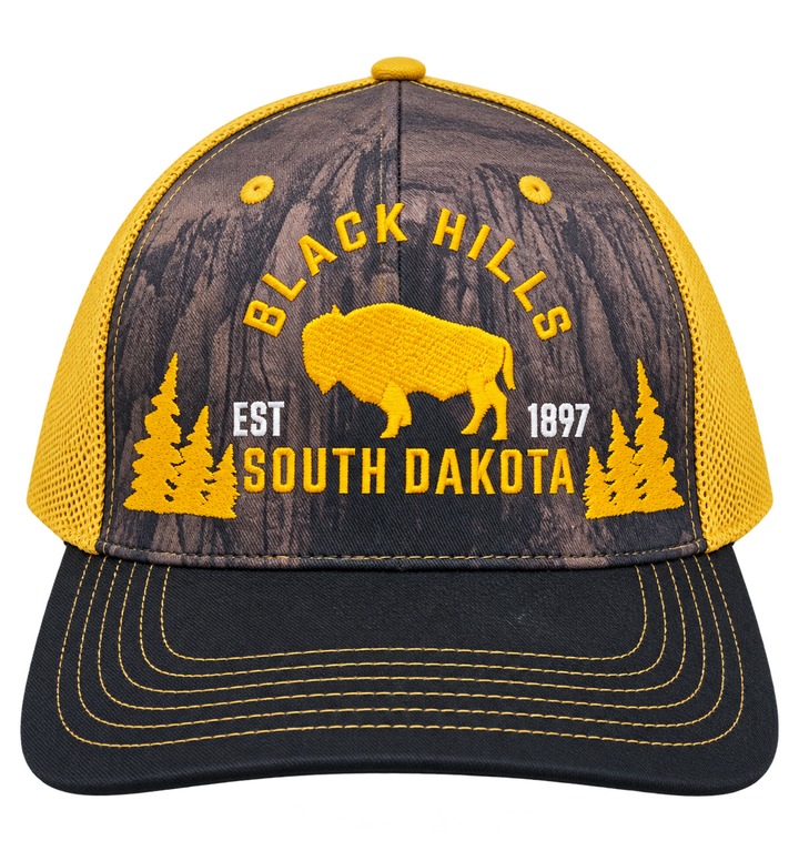 Black Hills South Dakota buffalo trucker hat with yellow embroidery, printed forest front and black bill
