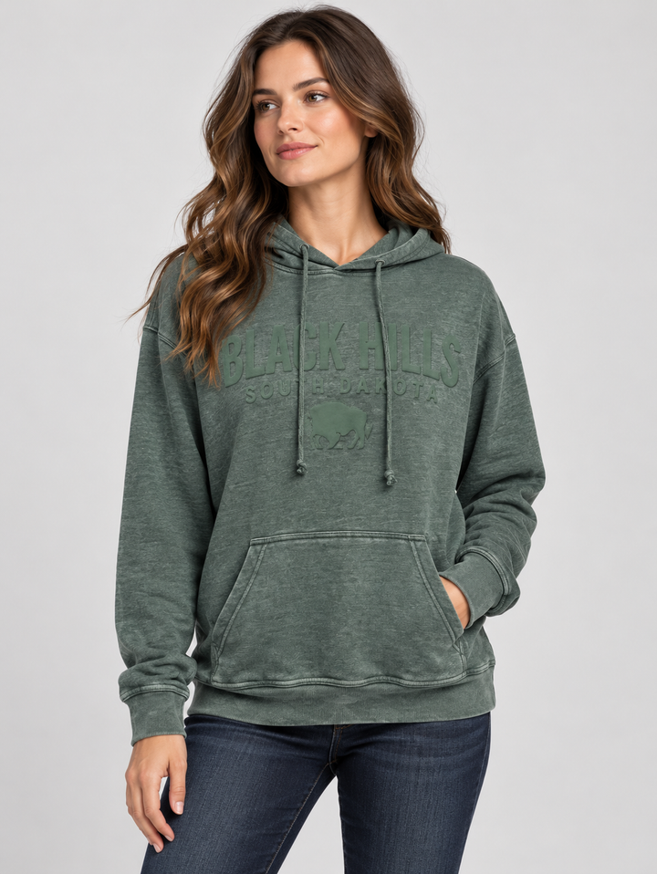 AI-generated model wearing green Black Hills Burnout Hoodie, front