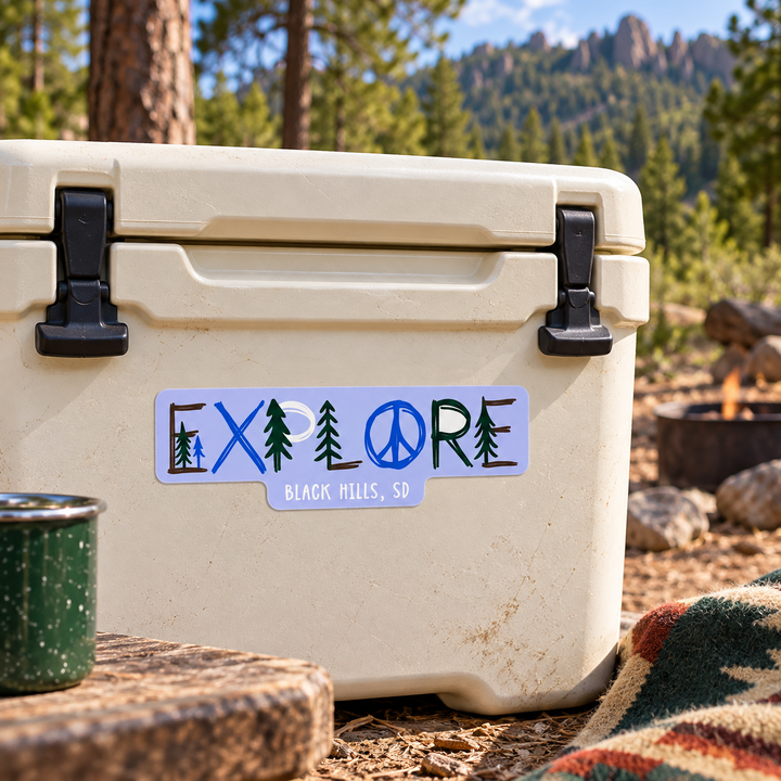 Black Hills Explore Pine Trees &amp; Peace Sign Sticker on a cooler — lifestyle display mockup; accessories not included
