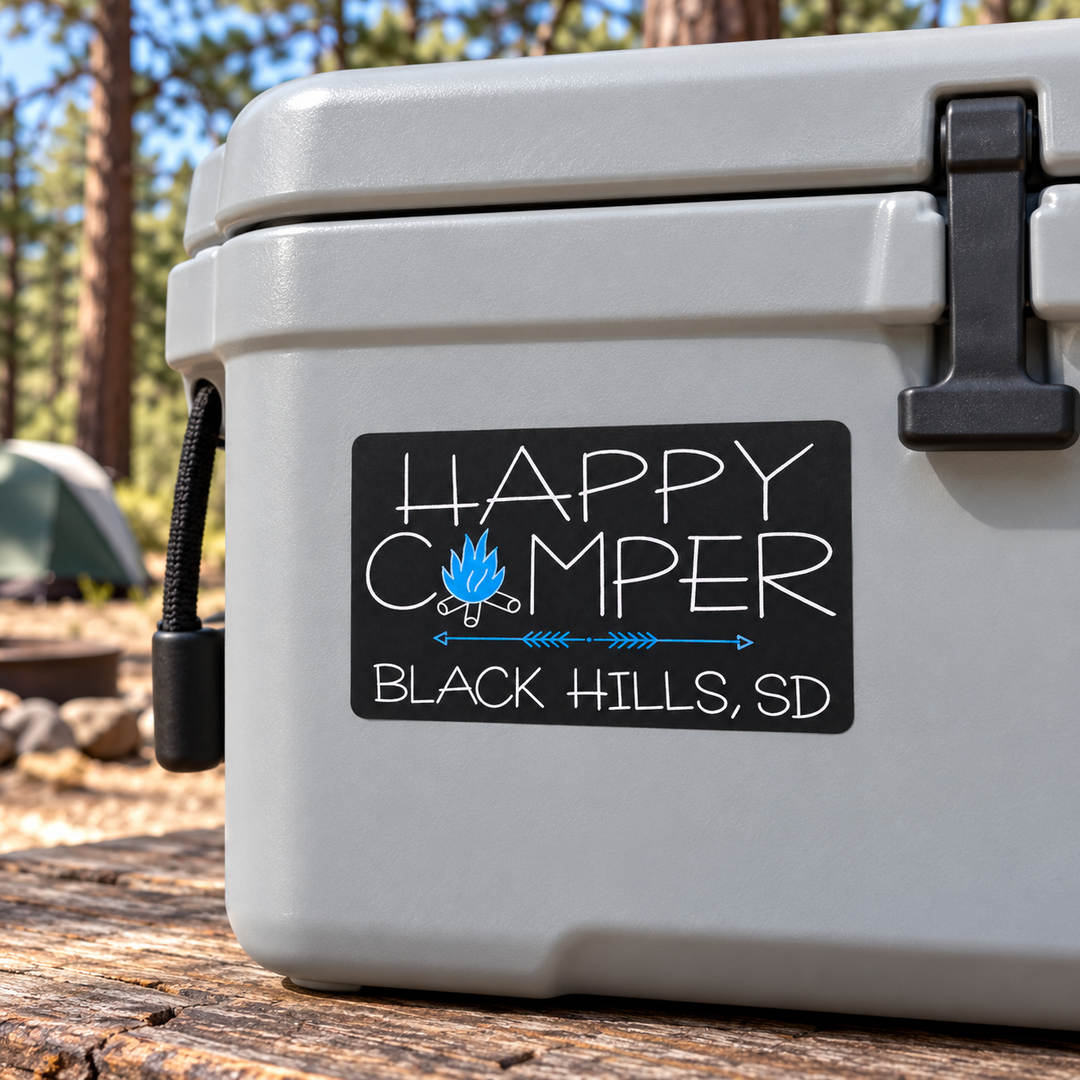 Black Hills Happy Camper Blue Campfire Sticker on a cooler — lifestyle display mockup