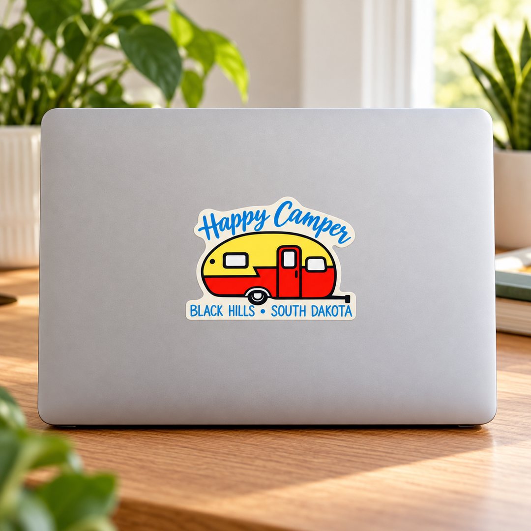 Black Hills Happy Camper Retro Trailer Sticker on a laptop — lifestyle display mockup