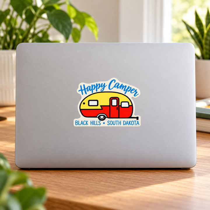 Black Hills Happy Camper Retro Trailer Sticker on a laptop — lifestyle display mockup