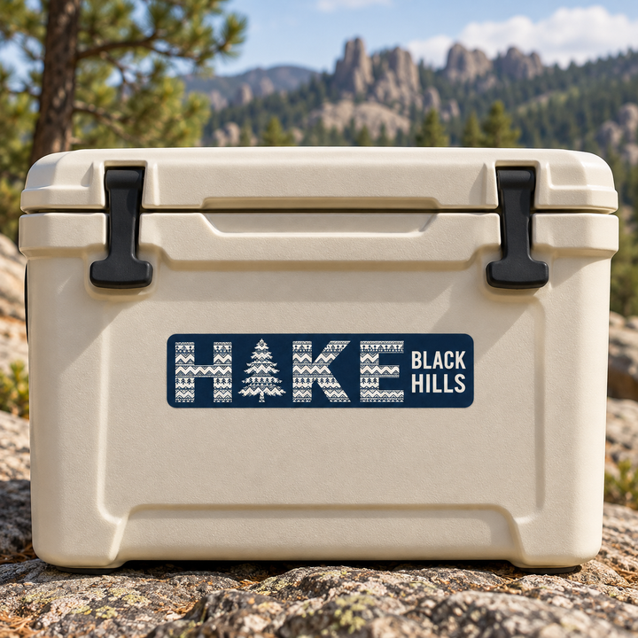Black Hills HIKE Patterned Pine Tree Sticker on a cooler — lifestyle display mockup; accessories not included