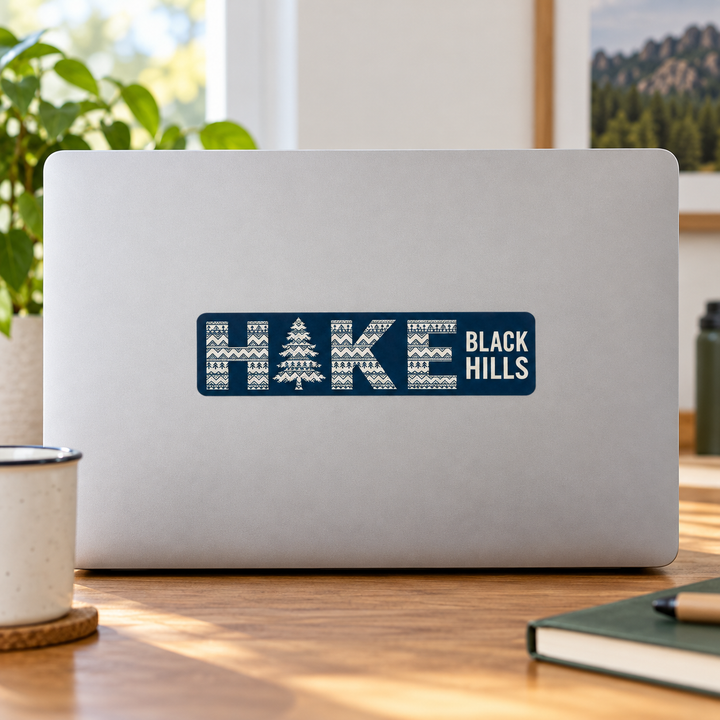 Black Hills HIKE Patterned Pine Tree Sticker on a laptop — lifestyle display mockup; accessories not included