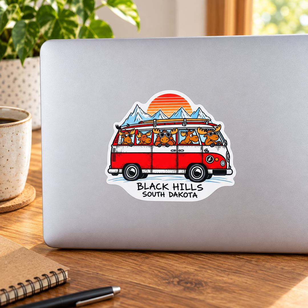 Black Hills Moose Camper Van Adventure Sticker on a laptop — lifestyle display mockup; accessories not included