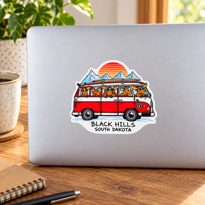 Black Hills Moose Camper Van Adventure Sticker on a laptop — lifestyle display mockup; accessories not included