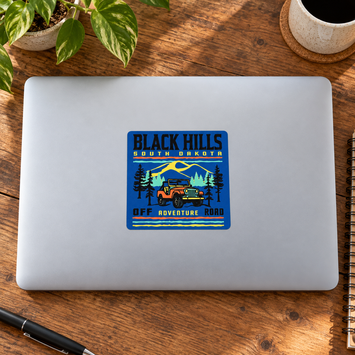 Black Hills Off-Road Adventure Sticker on a laptop — lifestyle display mockup; accessories not included