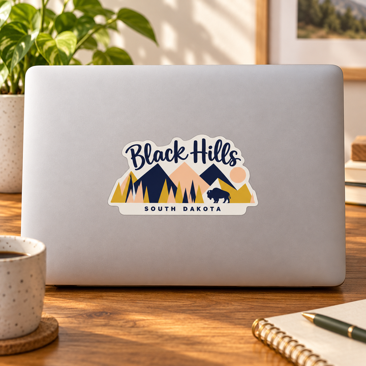 Black Hills Pastel Geometric Mountains &amp; Bison Sticker on a laptop — lifestyle display mockup; accessories not included