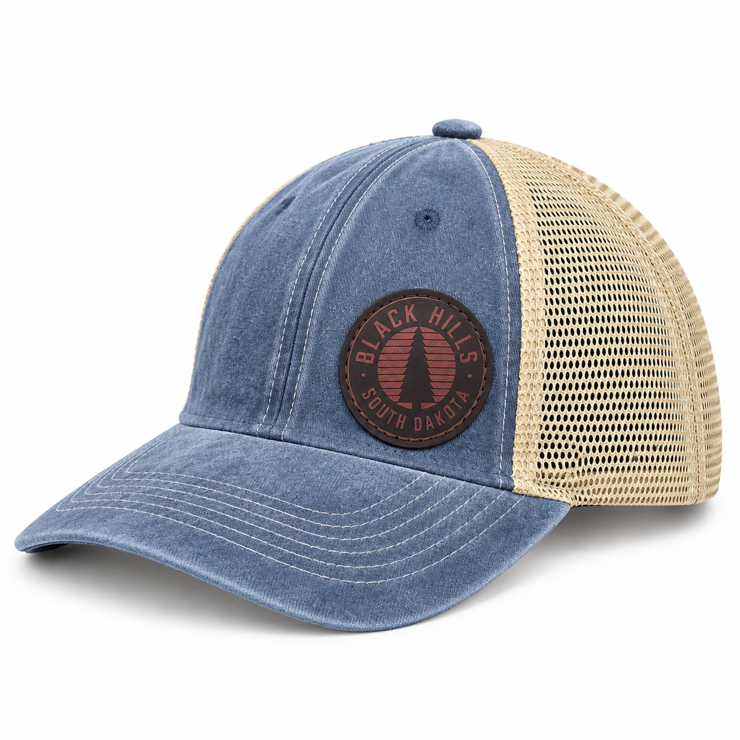 Black Hills Pine Tree Leather Patch Trucker Hat – Washed Blue &amp; Tan; left product view
