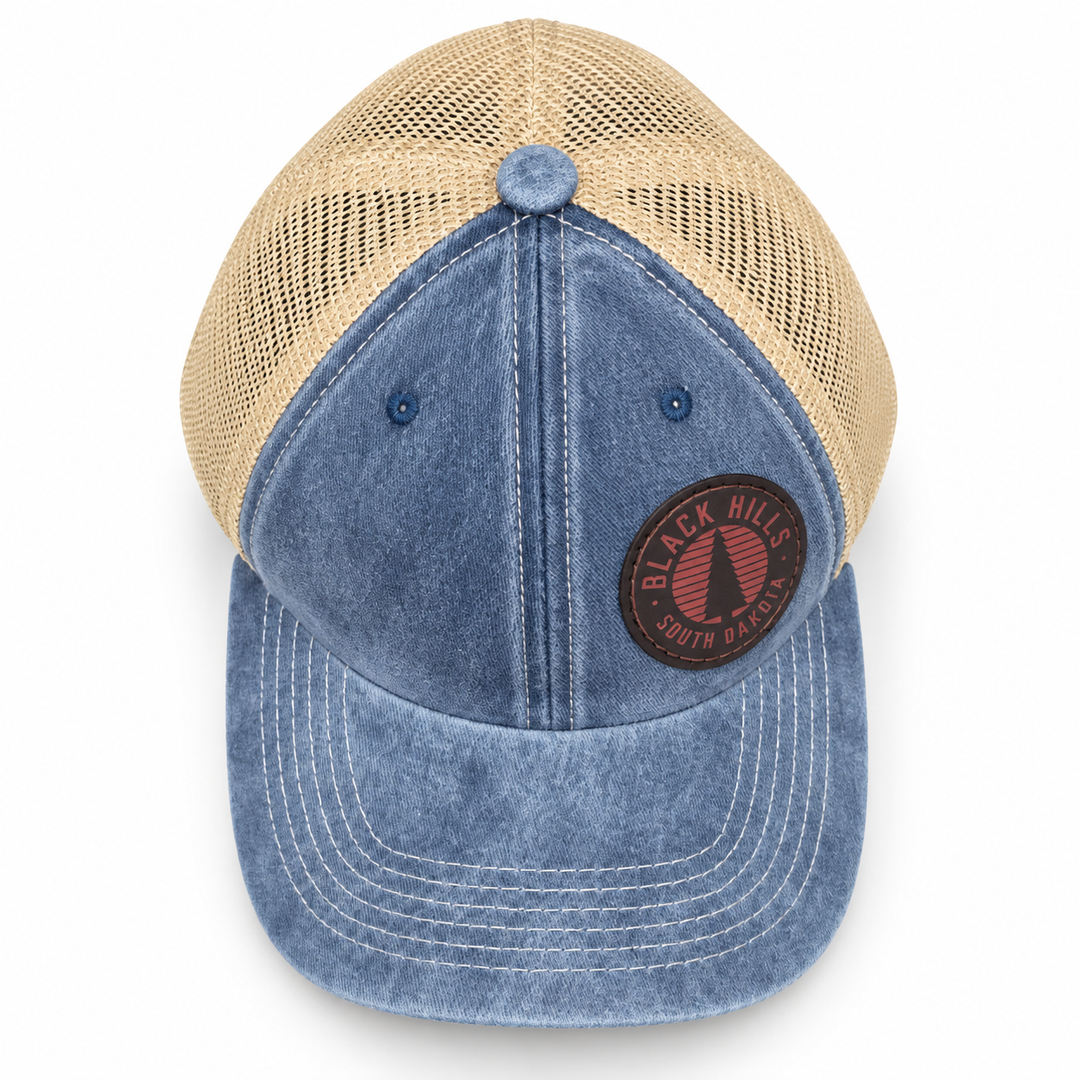Black Hills Pine Tree Leather Patch Trucker Hat – Washed Blue &amp; Tan; top product view
