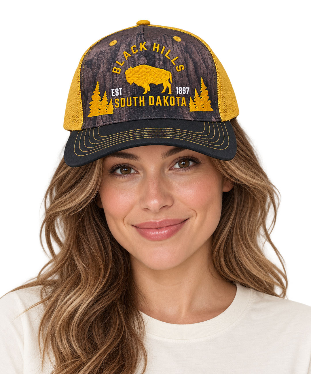 Woman wearing Black Hills buffalo forest trucker hat in yellow and black