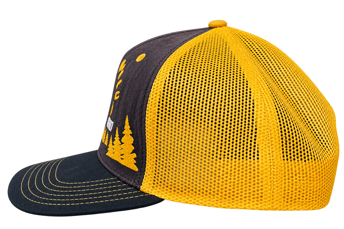 Side view of Black Hills buffalo trucker hat showing yellow mesh and black bill