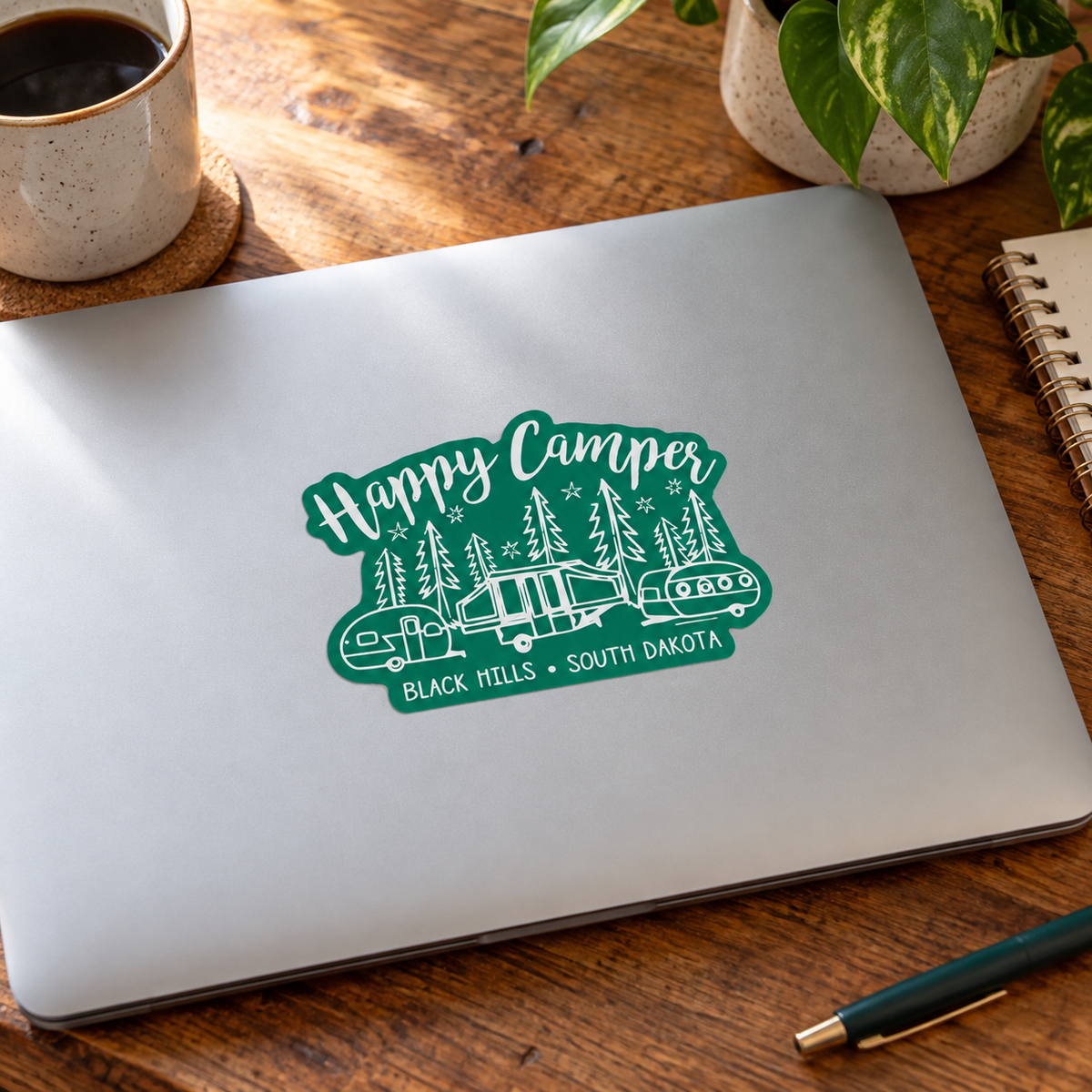 Black Hills Happy Camper Sticker on a laptop — display mockup