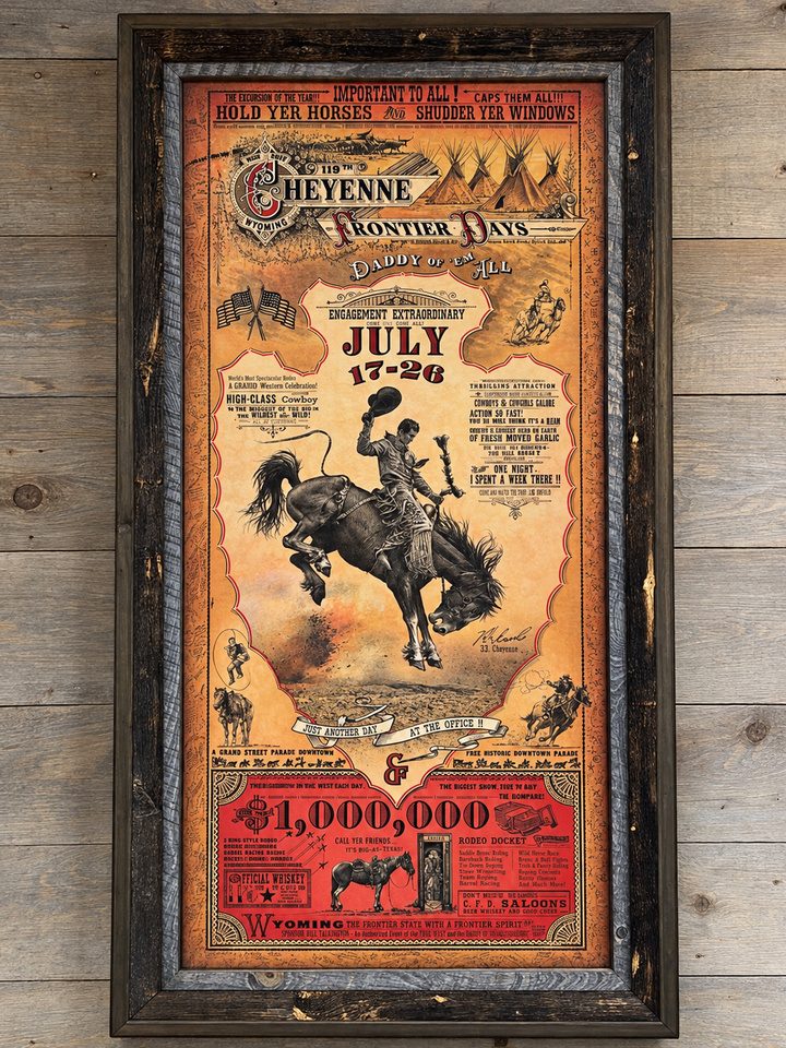 Retouched store view of the 2015 Cheyenne Frontier Days poster in its rustic barnwood frame, with glass reflections removed