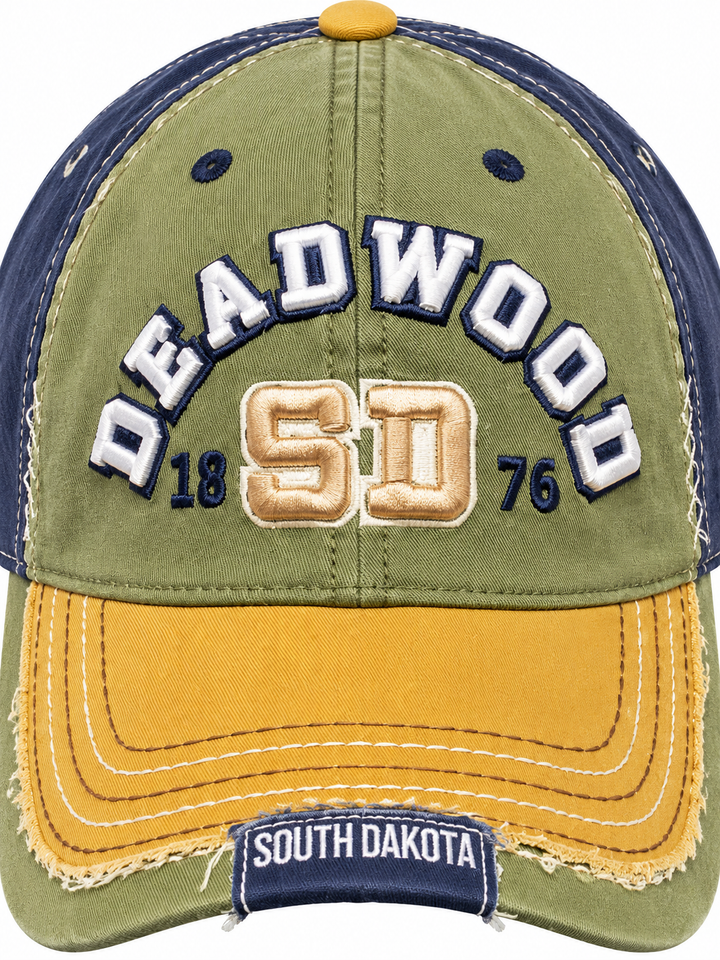 Close-up of raised Deadwood embroidery, SD monogram and distressed mustard bill stitching
