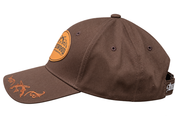 Brown Deadwood 1876 leather patch hat, side view with tan embroidered brim