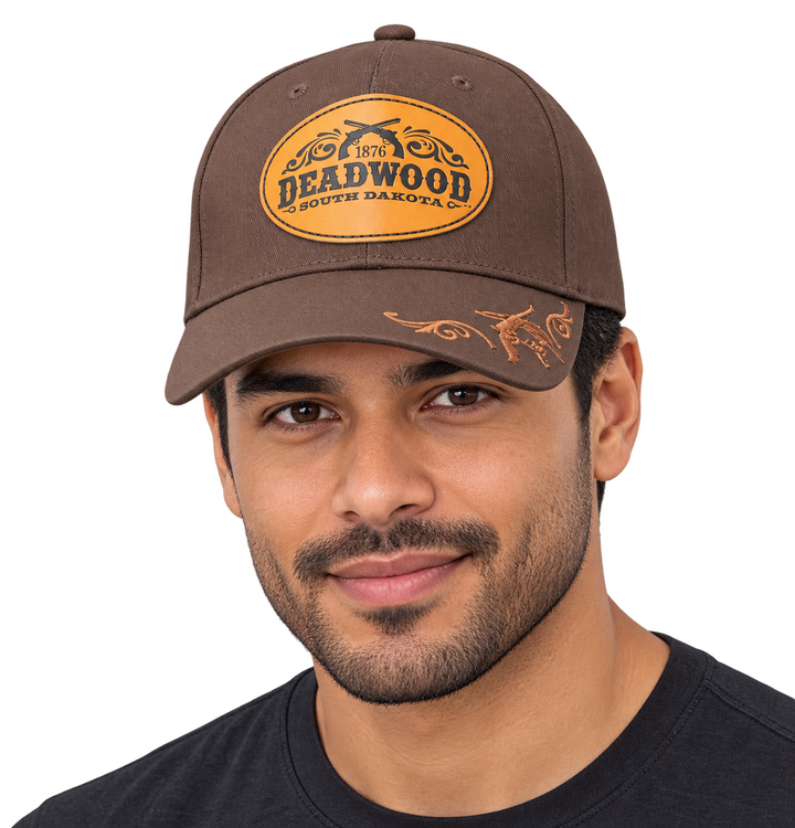 Brown Deadwood 1876 crossed revolvers leather patch hat, male model wearing hat (AI-generated)