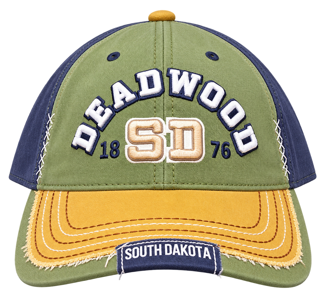 Deadwood 1876 hat with raised white lettering, olive and navy panels, mustard bill and decorative stitching