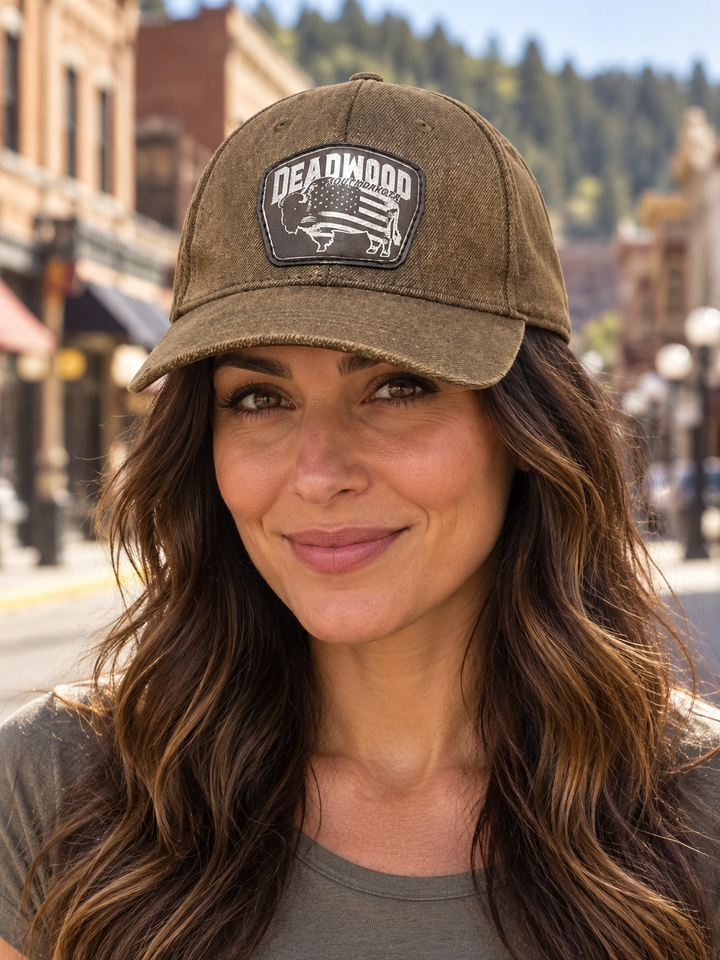 Deadwood American Flag Bison Leather Patch Hat – Washed Brown; female model wearing hat (AI-generated lifestyle image)